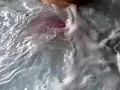 Curvy mom in thong bikini gets wet and wild in public hot tub