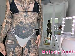 HD video of trans beauty Melody radford trying on a micro bikini and lace g string
