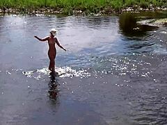 Russian mature woman takes a naked bath in the open air